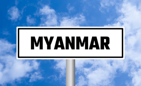Myanmar road sign on blue sky backgroundの写真素材