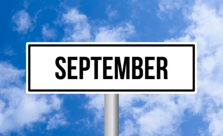 September road sign on cloudy sky backgroundの写真素材