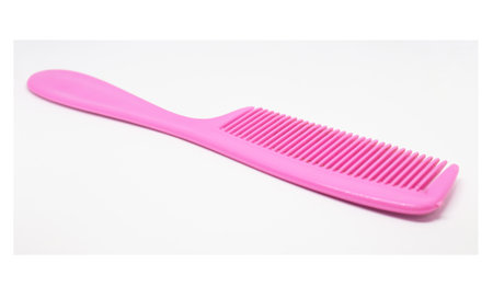 Pink hair comb isolated on white background