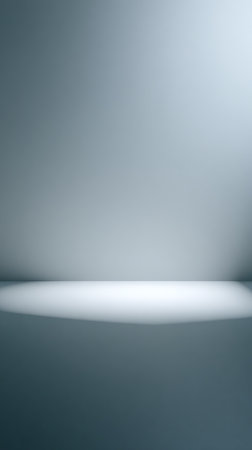 Clean, minimalist gray gradient background features a soft, subtle light and shadow gradient. Ideal as backdrop for presentations, product showcases, graphic designs, or visual compositions.の素材
