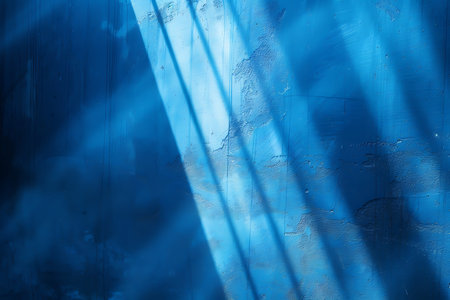 Abstract blue interior with concrete wall and sunlight.の素材