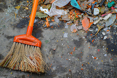 Broken broom and garbage on the floor, closeupの素材
