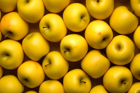 Yellow apples background, top viewの素材