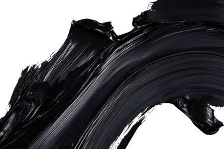 Featuring an expressive black paint stroke on a clean, white background. The textured surface shows brush marks and glossy highlights.の素材