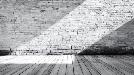 Monochrome, shot of rustic interior with a brick wall painted white and wooden floor with sunlight, casting shadows to create depth in the scene.の素材