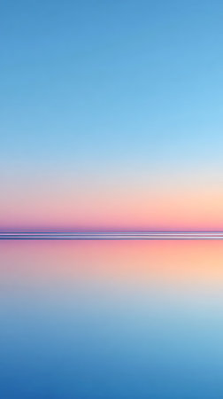 Gradient image showing a blend of blue, pink, and orange hues reflecting, divided horizontally by thin dark stripes on the horizon. The image evokes tranquility and peace.の素材