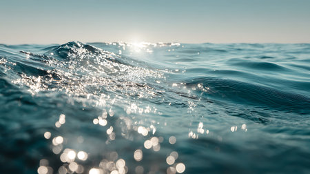 Close-up view of ocean waves shimmering with sunlight. Bokeh effect adds depth, enhancing the natural beauty and serene quality of the vast ocean landscape.の素材