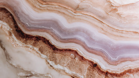 Detailed shot displaying the intricate, naturally-occurring banded patterns and swirling textures within an onyx stone. Earthy tones and prominent pink hues create a visually appealing stone.の素材