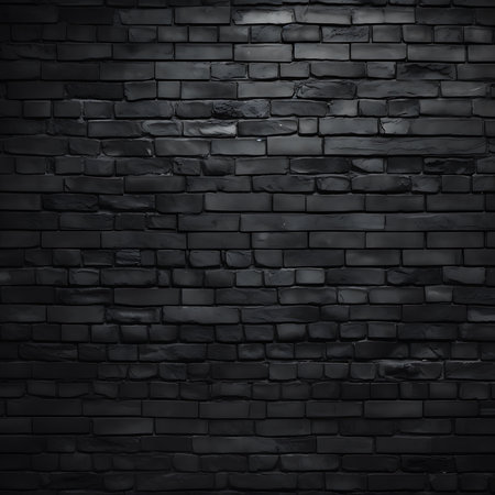 Monochromatic black brick texture provides a bold and rugged aesthetic. This stone wall background brings depth with its rough, architectural features and subtle tonal variations.の素材