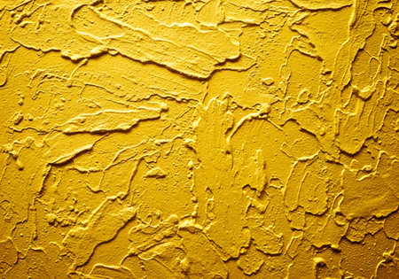 Yellow painted wall. Abstract background and texture for design and ideas.の素材