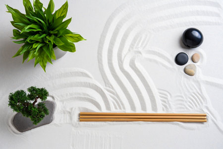 Zen garden arrangement with plants stones and raked sandの素材