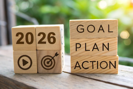 Wooden blocks display the year 2026 and the words Goal Plan Action.の素材