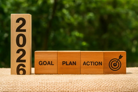 Wooden blocks showing 2026, goal, plan, action, and a target for success.の素材