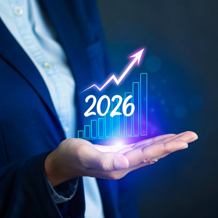 A hand holds a glowing projection of a bar graph and an upward trending arrow with the year 2026 displayed.の素材