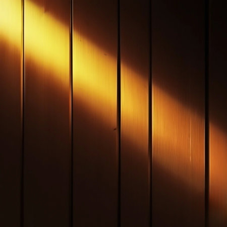 Warm golden light beam illuminating vertical wooden planksの素材
