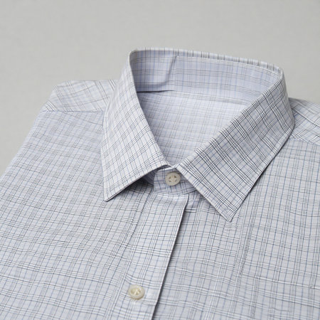 Close up of a light grey textured men s dress shirt collar and placketの素材