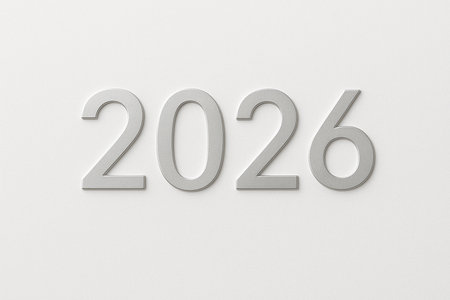Metallic silver numbers spelling out the year 2026 on a clean white background.の素材