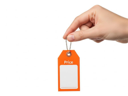 Hand holding price tag isolated on white backgroundの素材