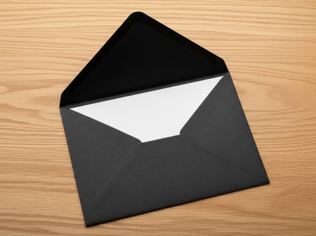 Black envelope with white flap isolated on white backgroundの素材