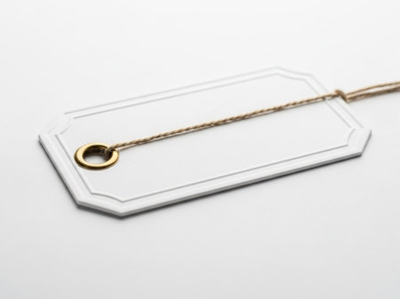 White tag with string isolated on white backgroundの素材