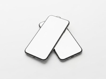 Two smartphones stacked togetherの素材