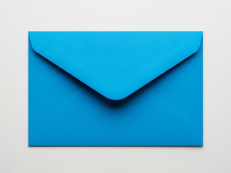 Single blue envelope on light backgroundの素材