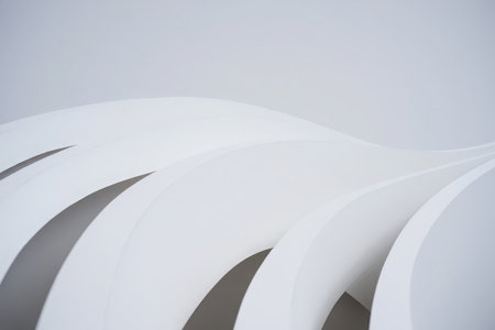 Minimalist abstract image featuring flowing white curves and subtle shadows.の素材
