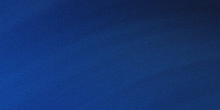 A serene and expansive view of the night sky, featuring a deep blue hue with subtle variations in...