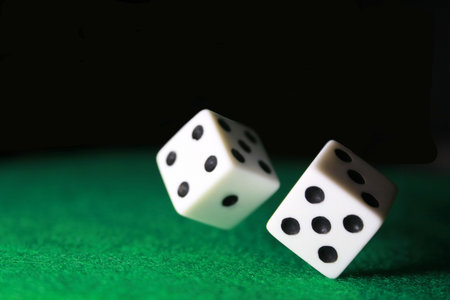 Dice over green feltの写真素材