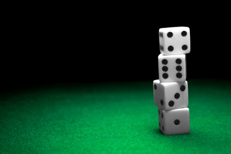 A stack of dice over a green felt table