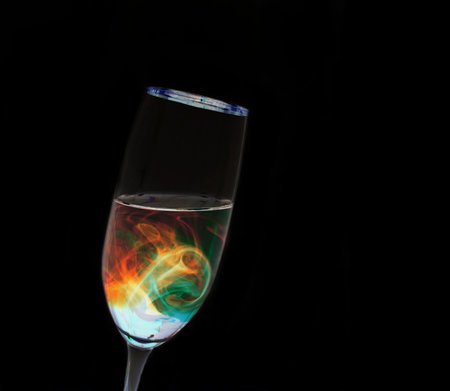 A leaning glass with futuristic looking liquid insideの写真素材
