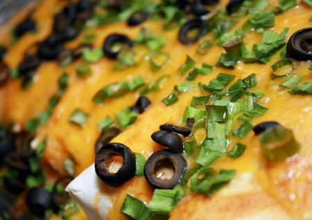 A pan full of hot, cheesy enchiladasの写真素材