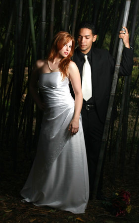 Sexy couple standing in a bamboo forestの写真素材