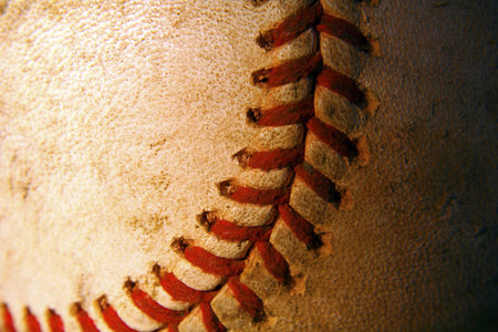 A closeup of an old weathered baseballの写真素材