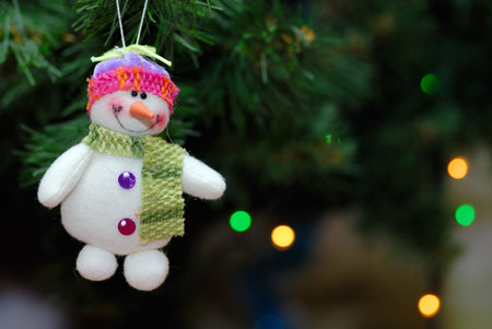Snowball toy on christmas treeの写真素材