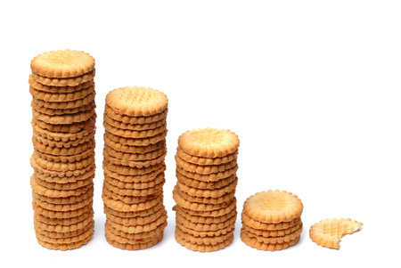 Descending graph made out of stacks of cookiesの写真素材