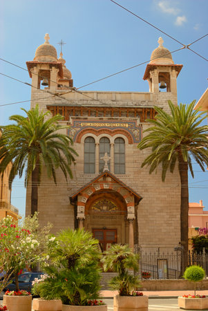 Catholic church on the street of Mediterranean cityの写真素材