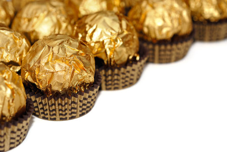 Sweets in wrapper isolated on whiteの写真素材