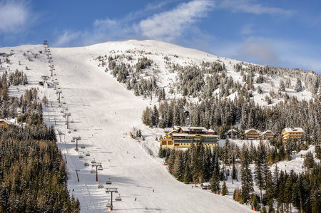Skiing slope with chairlift on ski resort in Austrian Alpsのeditorial素材