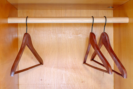 Empty hangers in wardrobeの写真素材