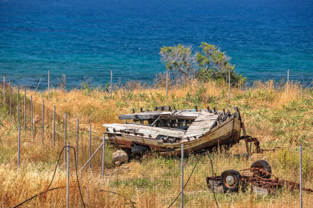 Old broken wooden boat on seashoreの写真素材