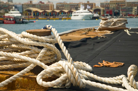 Rope on a knight with yacht in the background.