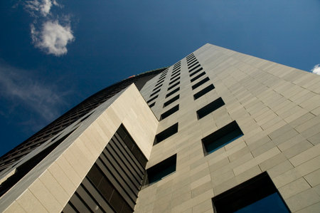 Business skyscrapers with silver metalic walls sunshine.