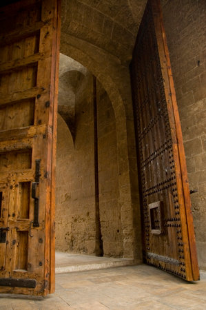 Old wooden gate in the walls of Valencia.の写真素材