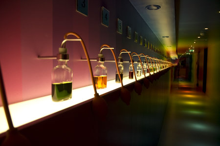Many bottles with different colors in a row.の写真素材