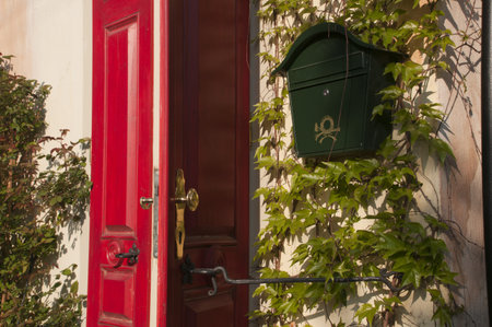 Door and post box on the wallの写真素材