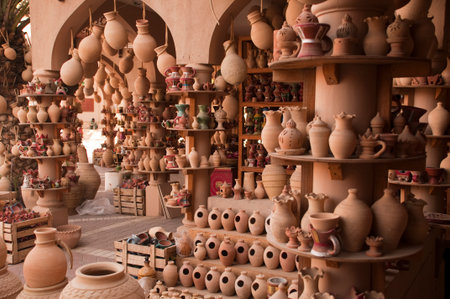 Hanging rough clay jars on the stringsの写真素材