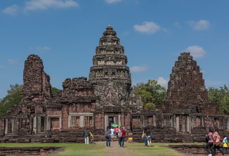 Phimai, THAILAND - November 29, 2015: Tourists in Phimai Historical Park. Phimai is a town in Nakhon Ratchasima Province in northeast Thailand.The Phimai historical park protects one of the most important Khmer temples of Thailand.のeditorial素材