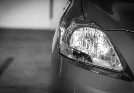 Headlights like eyes when driving on the road.の写真素材