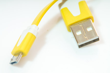 the yellow mobile charger for the mobile phone]の写真素材